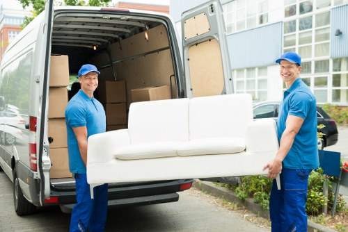 Team reviewing ethical labour compliance documents for Harrow Man And Van