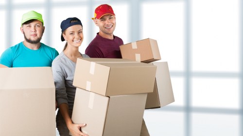 Moving team loading household items for a Harrow relocation