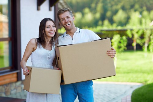 Movers handling desks and office furniture during a Harrow move