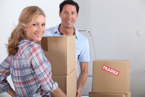Packing and wrapping household items for a move in Harrow
