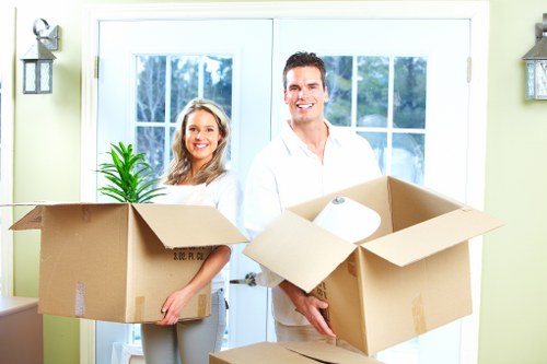 Packed moving boxes and furniture ready for local removals